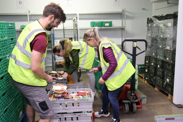 Volunteers unpacking food delivery for community members in Wales